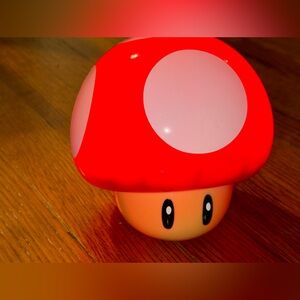 Super Nintendo World Toad Mushroom Light. Makes noise when pressed on to turn ON